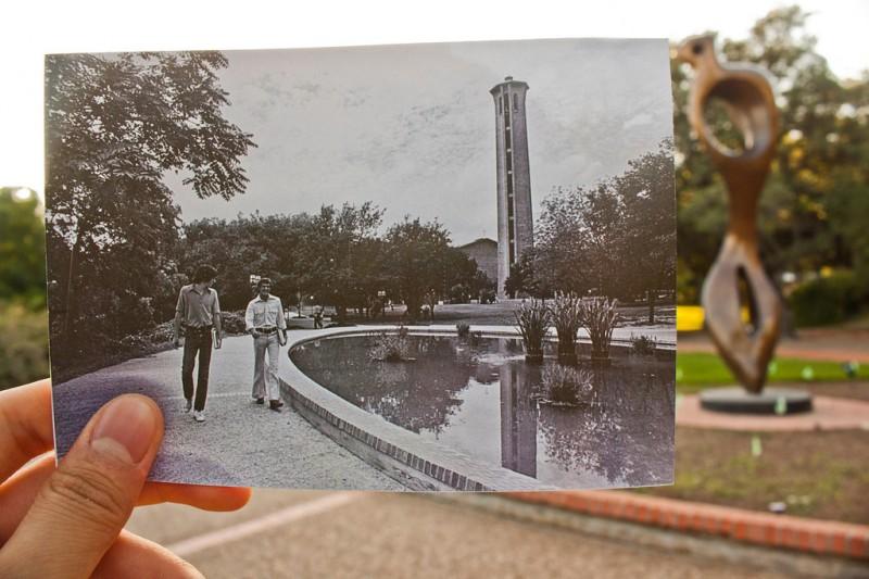 Sophomore Anh-Viet Dinh holds up a photograph of Murchison Tower, found in the librarys archives, over the modern day location. This photograph and many others like it are part of an exhibit that opens at 5 p.m., Wednesday, Oct. 10 on the second floor of the Coates University Center. Photo by Anh-Viet Dinh.