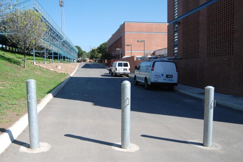 Prior to the arrival of of the poles, the road between the Bell center and the football field was blocked due to construction on the new Facility Services building. The poles appearance eradicated any hope the road would open to vehicular traffic again. The closure marks the beginning of an effort to make Trinitys campus more pedestrian friendly. Visit trinitonian2020redesign.mystagingwebsite.com to voice your opinion about the poles in this weeks poll. Photo by Matthew Brink.