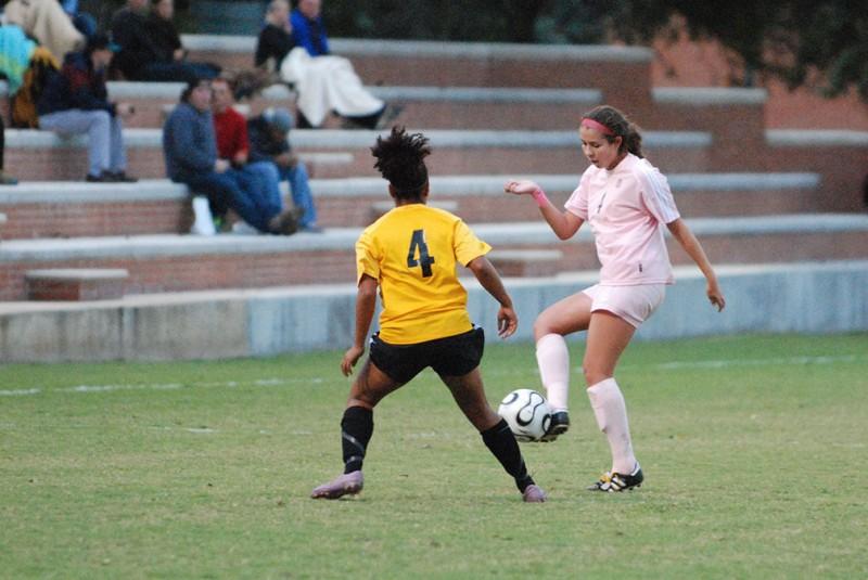 Sophomore defender Carley Kocel fights for possession during last Fridays game against Southwestern University. The team didnt only fight against the opposing team, but also against breast cancer, raising $10,000 for the cause. Photo by Megan McLoughlin.