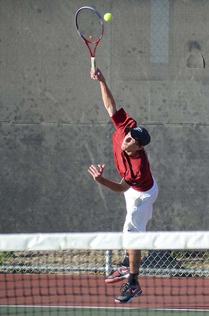 Sophomore Jordan Mayer serves a pass to a Laredo Community College opponent Saturday afternoon. Photo by Matthew Brink.