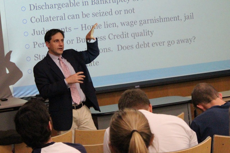 Michael Taylor, former bond salesman at Goldman Sachs, teaches a personal finance class with professor of business administration Dante Suarez. Taylor currently writes for Bankers Anonymous, a website that deals with conversations about finance. Photo by Megan McLoughlin.