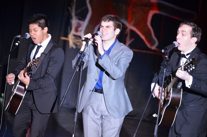The Daytrippers, sophomores Victor Vo, Mason Walker and Reagan Wilkins, perform Skyfall by Adele at Spotlight. The band is organizing the third Rooftopalooza at 9:07 p.m. Friday, April 26, on McLean Roof. Photo by Jennie Ran.
