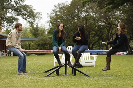 Matt Hopper (SO), Megan Buford (JR), Catherine Garza (SO) and Lindsey Ulin (FY) sit on a seesaw between classes as part of  Pikeâ€™s charity for the Childrenâ€™s Shelter.