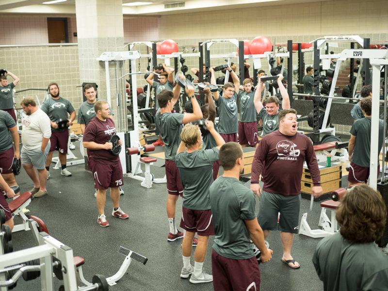 The football team trains during the off season.