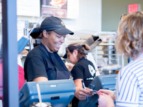 MICHELLE ALEXANDER takes a customerâ€™s order with a smile on her face during a busy afternoon at Einsteinâ€™s. 


Photo by Claudia Garcia
