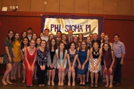 Members of Phi Sigma Pi pose for a photo at their 2016 Spring Banquet, where they celebrated receiving the Most Improved New Chapter Award with food, a photobooth and big and little reveal. 