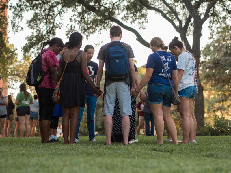 Students gather to pray after the vigil. photo by AMANI CANADA