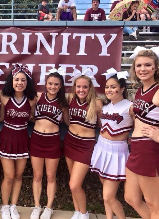 Each year at a home football game, the Trinity cheer team shows off vintage uniforms for the fans. Photo provided by Zoe Heeter