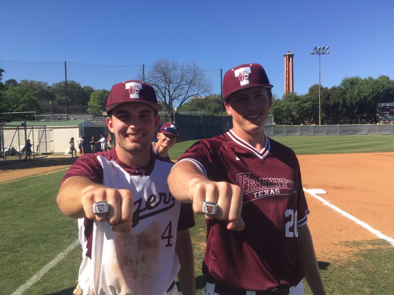 John Tucker (left) and Trevor Johnson show off the rings from the Tigers national championship title in 2016, when both were first years. photo provided by Emma Birbeck.