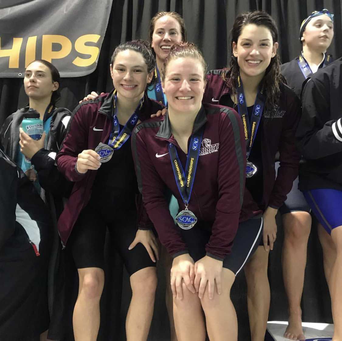 Morgen Reyna FY, Paige Johnson SR, Jadyn Trahan FY, Mabel Fowler SO on podium for 2nd place finish in 400 medley relay
