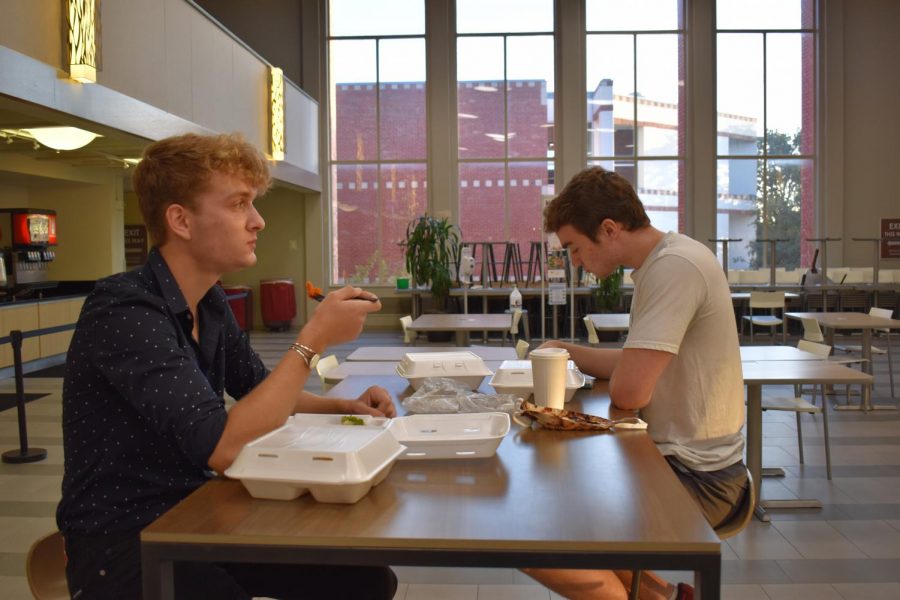 First-years John Hawes and Sean Mitchell eating dinner at Mabee Dining hall, an Aramark dining service.
