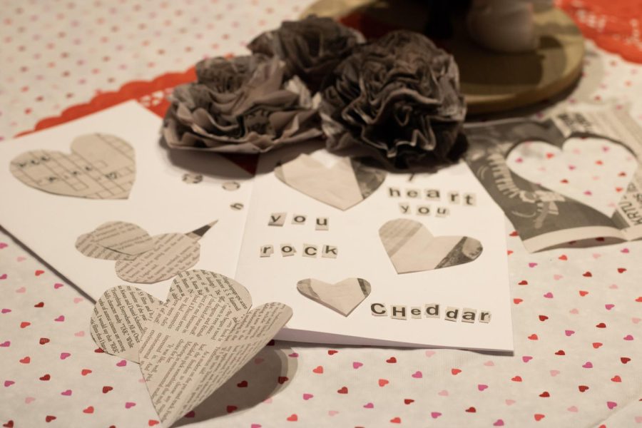 Cards, hearts, and table decorations made from newspaper.