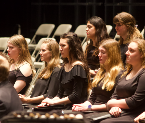 Trinity women in choir sing at the performance during Womens History Month.