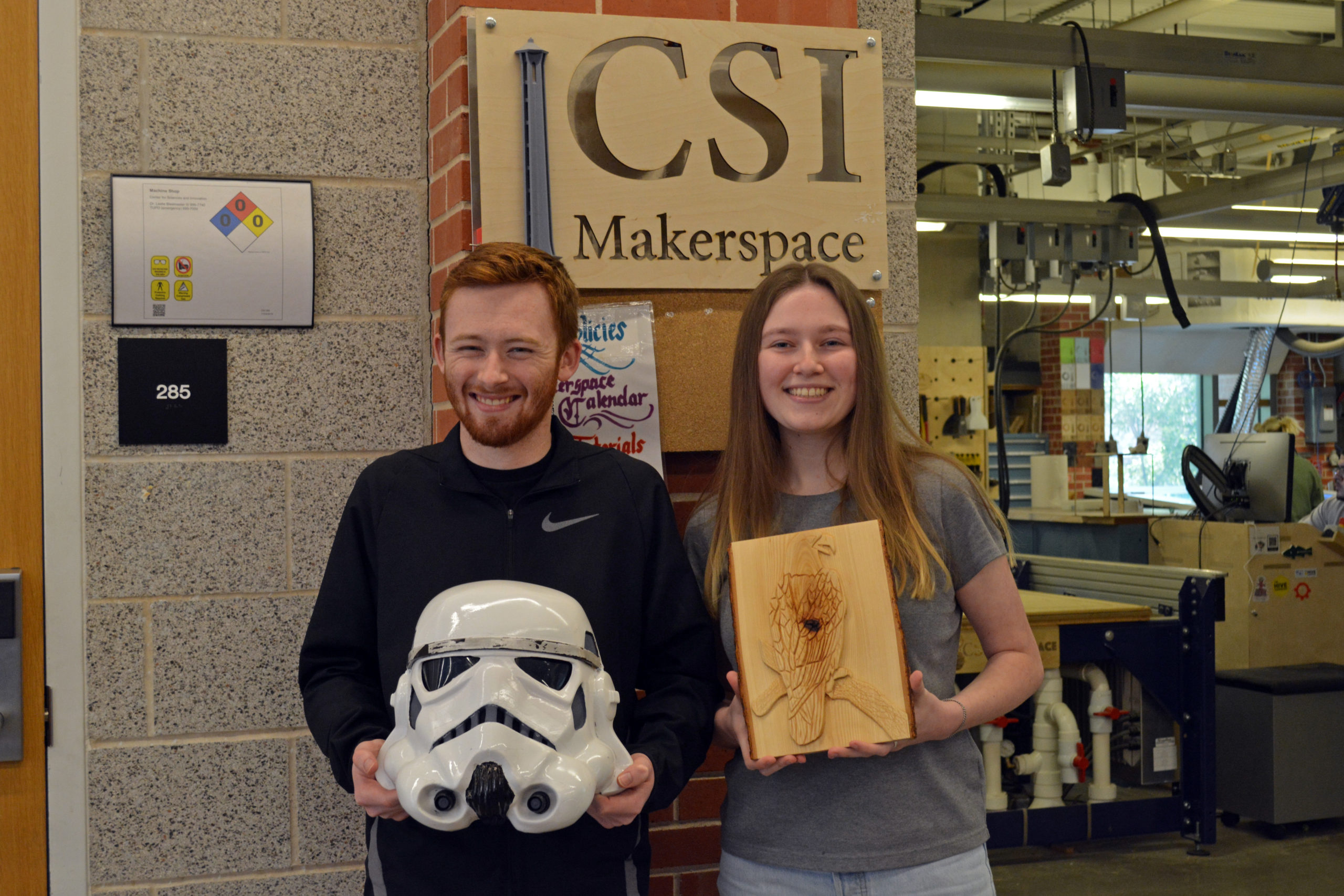 Dawson Durr and Grace Robertson show off their designs made in the MakerSpace.