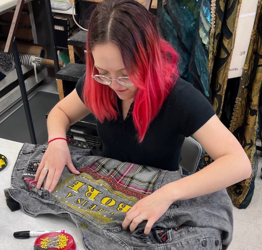 Junior Emily Brodie makes costumes for the performance of Stupid F*cking Bird that was intended to utilize a fake gun firing blanks. The gun was confiscated by TU officials.