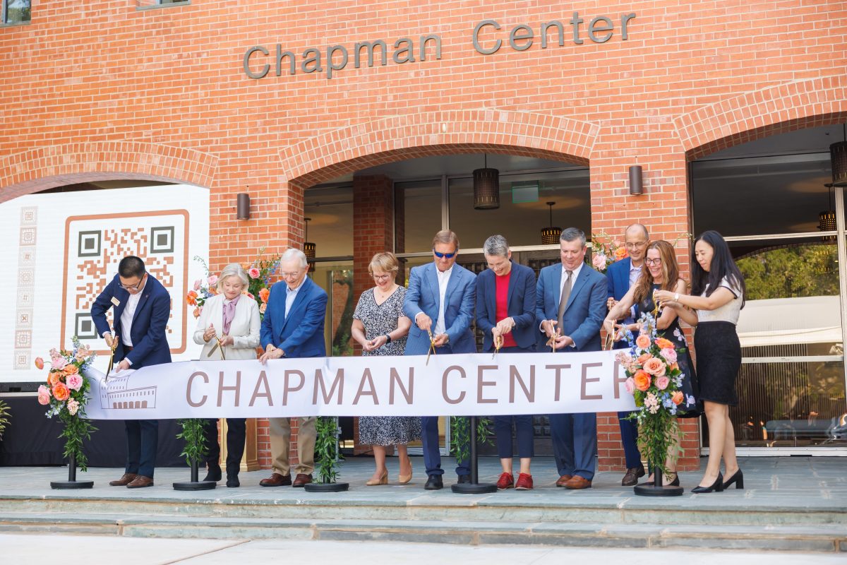 President Beasley and members of the Trinity community cut the ribbon at the Chapman rededication ceremony.