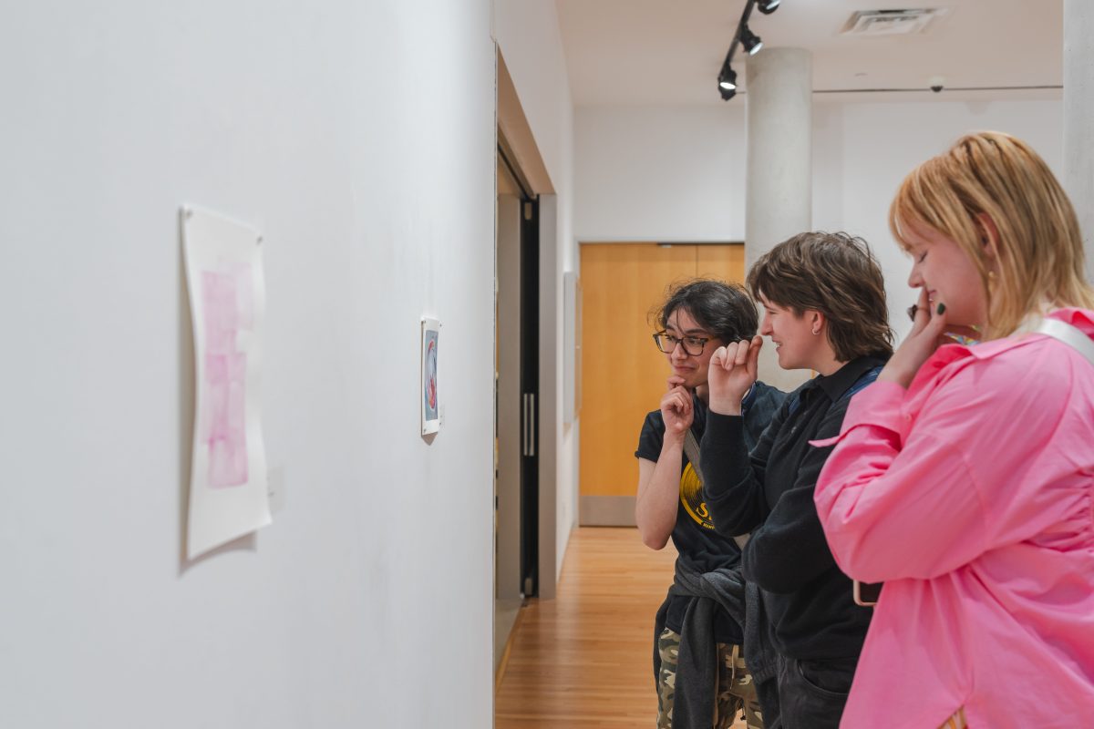 Students+observe+Eleanor+Perriers+artwork+at+the+MINI+art+exhibition.