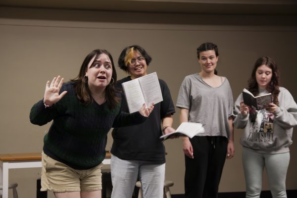 (Left to right) Freshman Arwen Loxsom playing Wren, freshman Arlo Castilan playing Vern, sophomore Em Miller playing Ginny, and freshman Besty Hammer playing Lulie. Wren talks to the other women about being a lesbian. 