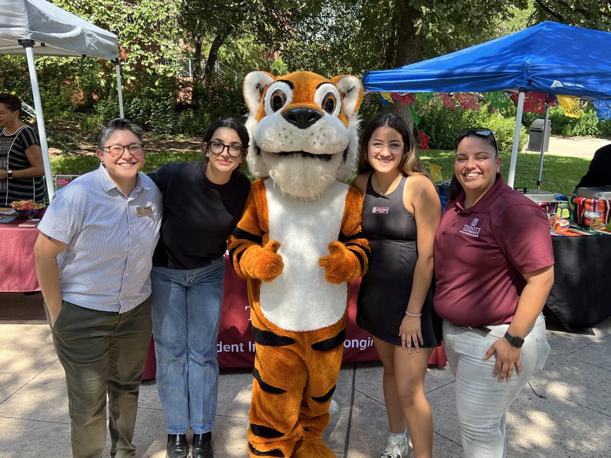 Student Inclusion and Belonging (SIB) team members pose with LeeRoy as El Mercado kicks off and National Voter Registration Day winds down.