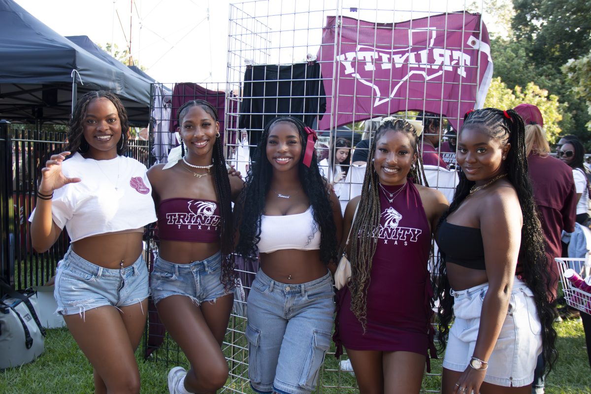 Group of friends poses with repurposed clothes for Trinity football game