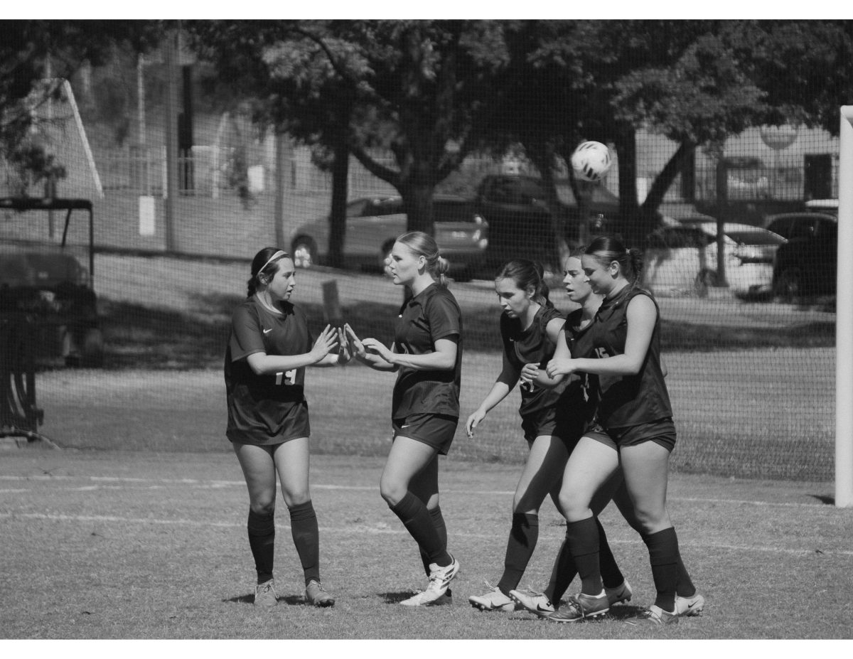 Madisyn Barganski celebrates with her teammates after a goal.