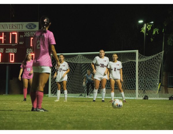 Sophomore defender Malea Cesar lines up for a free kick against Schreiner University defenders.