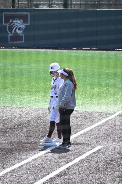 Trinity First Batter Carsyn Lee (Left) next to Trinity Softball Coach Jazmyne Cortinas (Right)