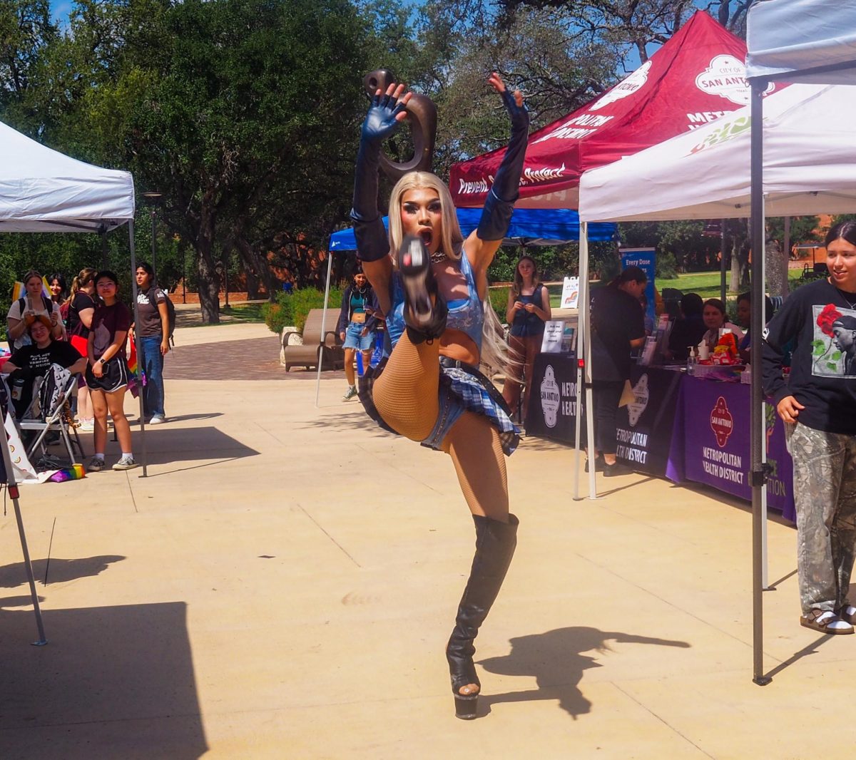 Miami Andrews does a high kick on the runway