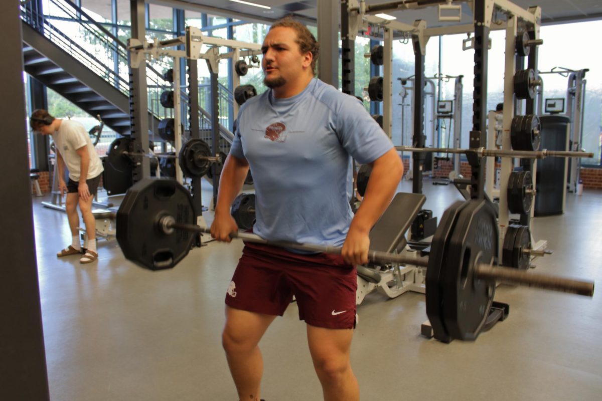 Caleb Bayer works out at the Bell Center