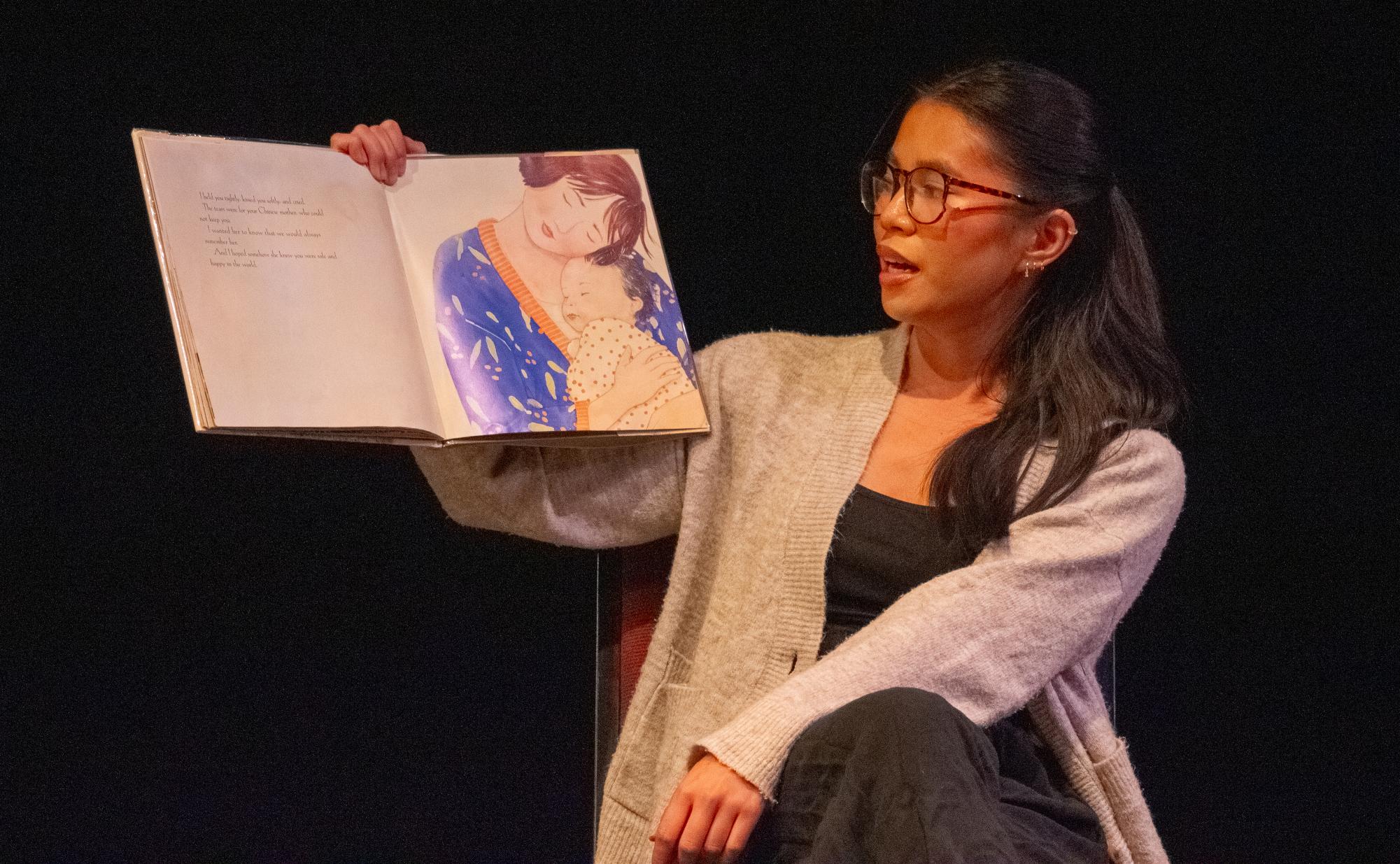 LEAH WOEHR reads from a children’s book that her mother read to her as a child.  