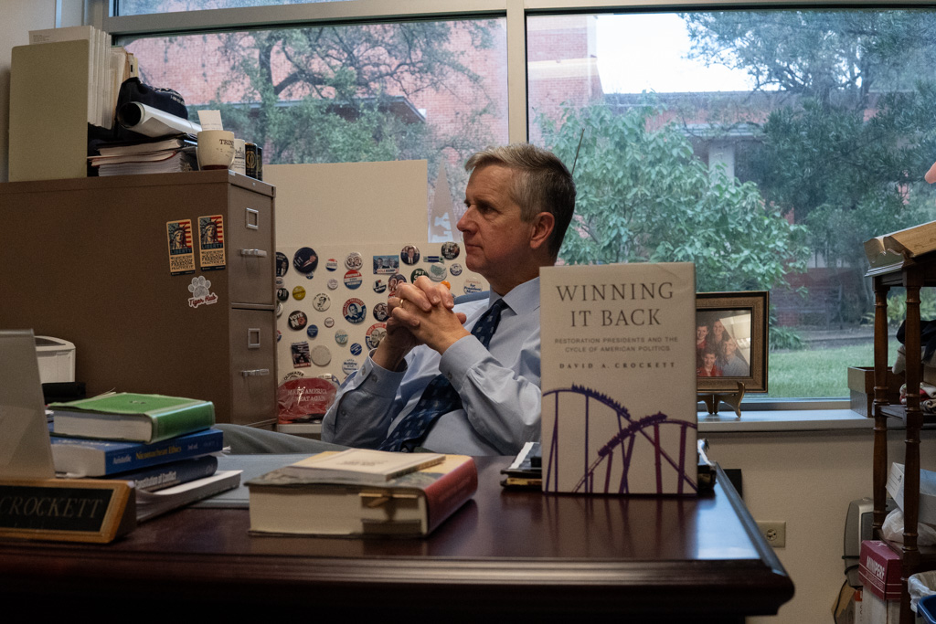 Dr. Crockett sits in his office with new book, “Winning it Back: Restoration Presidents and the Cycle of American Politics.”