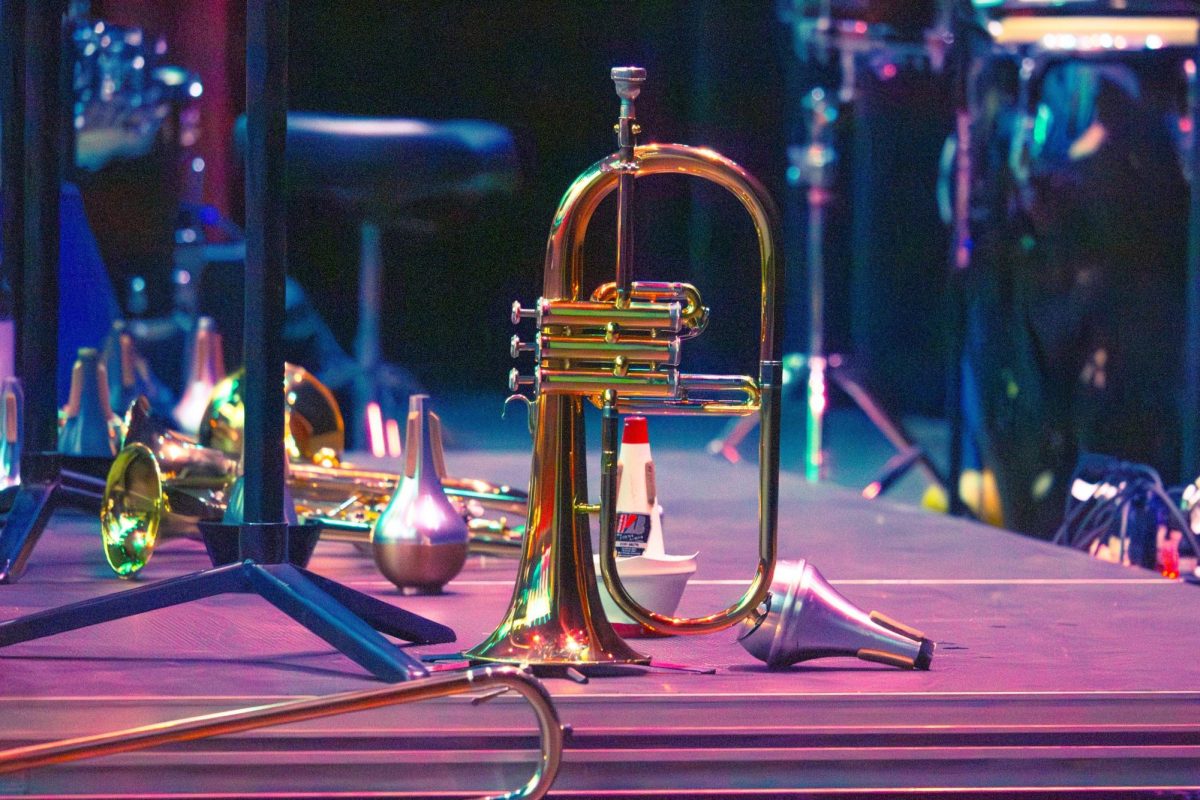 Stage lights reflecting off a trumpet. Philomusica is a Greek word that roughly translates to "loving music."