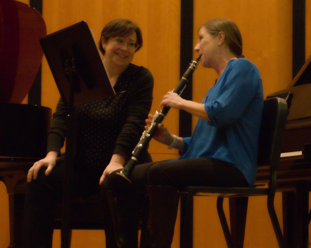 Carolyn True shares a smile with Stephanie Key during the 'I SOLO'd with SOLI' Chamber Concert last month.