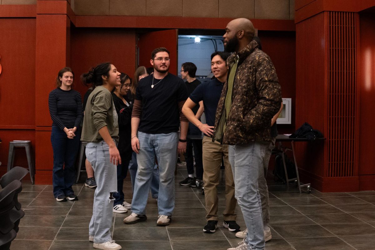 Cast members of The Mark Drama greet the attendees of the show.