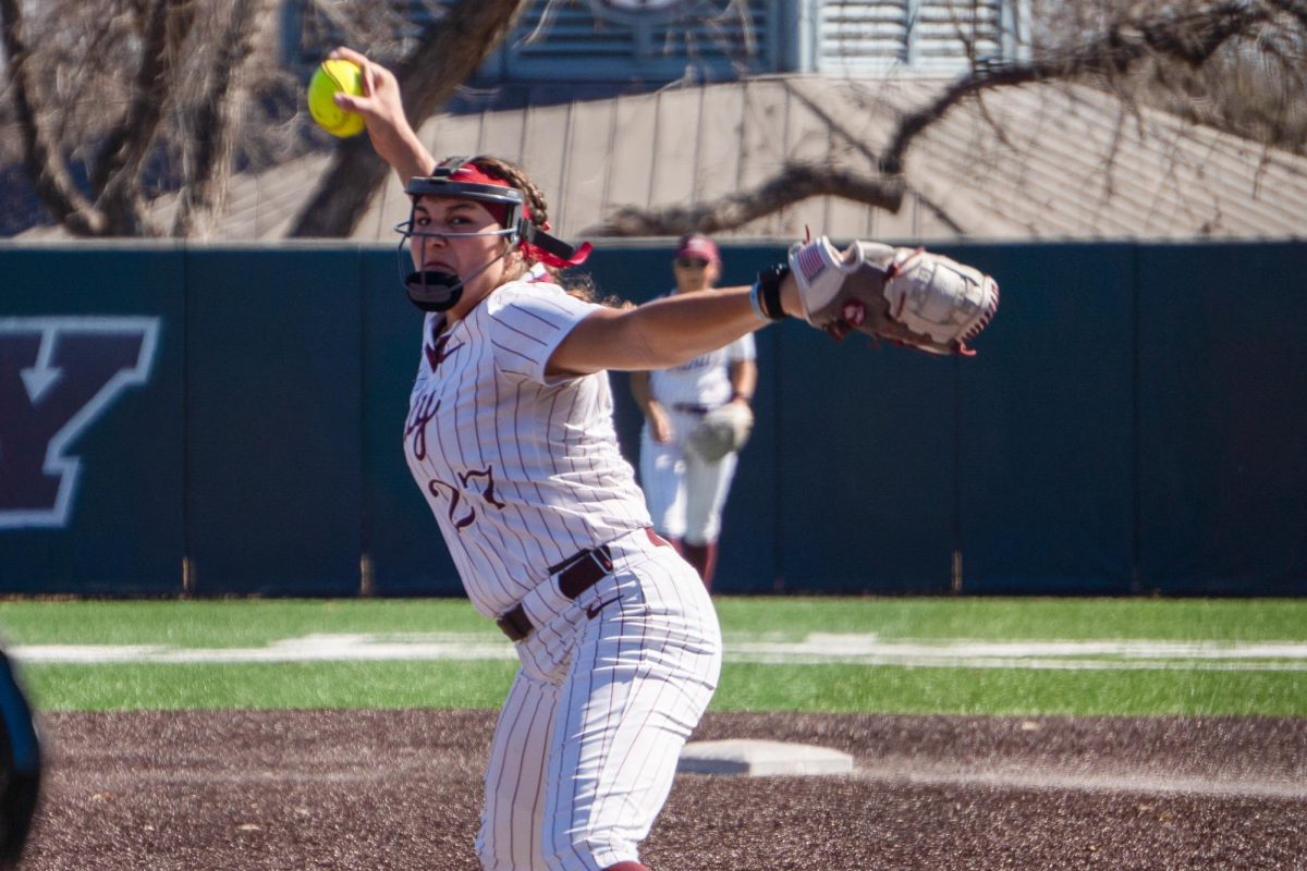 Senior relief pitcher Jordan Arce winds up to pitch.