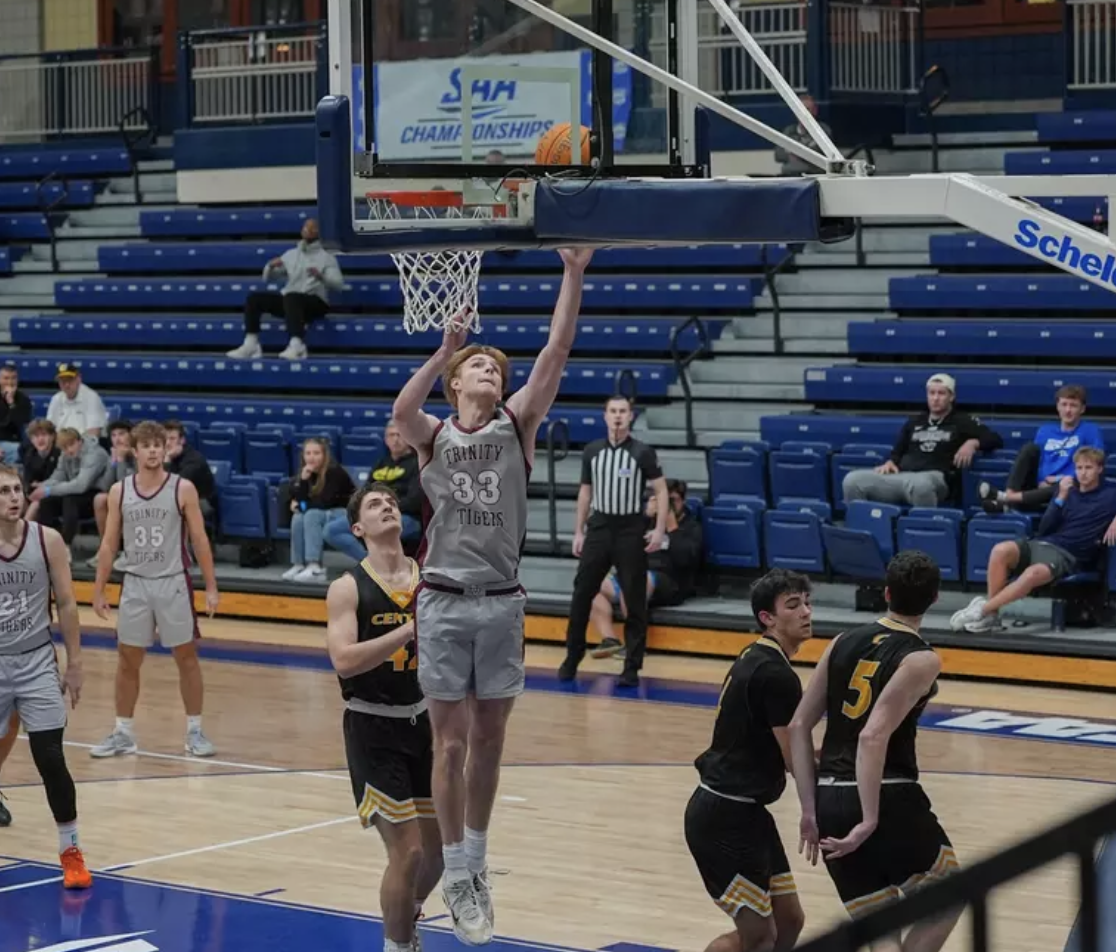 Will Bronson puts up a lay up in the SAA Championship semi-final against Centre College. Photo courtesy of Trinity Sports Information.