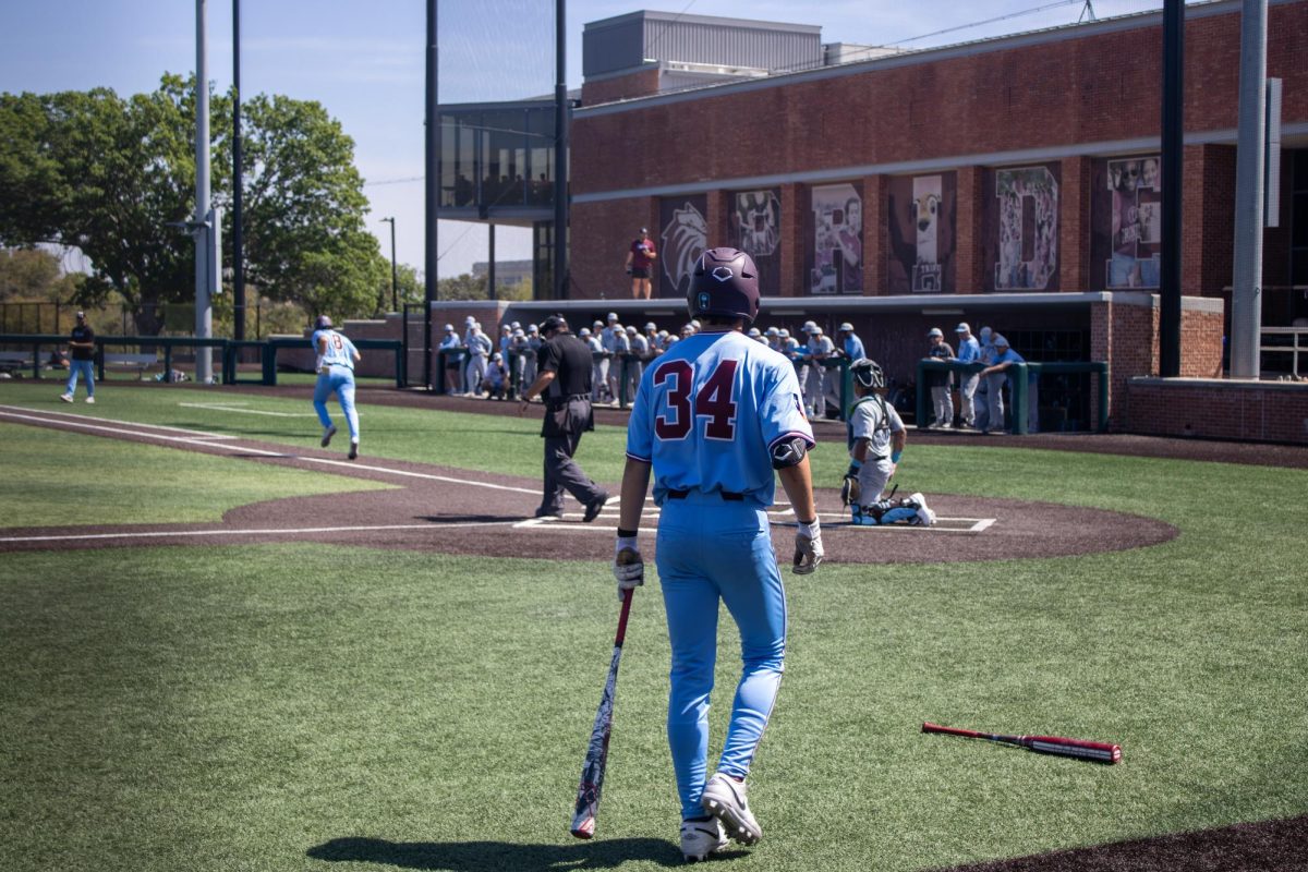Freshman Owen Rappe waits with bat in hand, preparing to step to the plate at the baseball field at Trinity University on March 15.