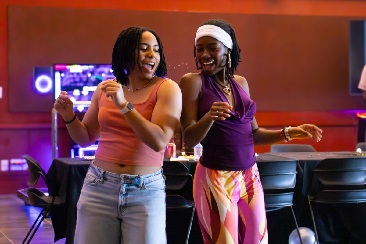 Elise Potier and Shea Bedminster dancing shoulder to shoulder at the 5th annual Black Essence Festival "Soul Train"