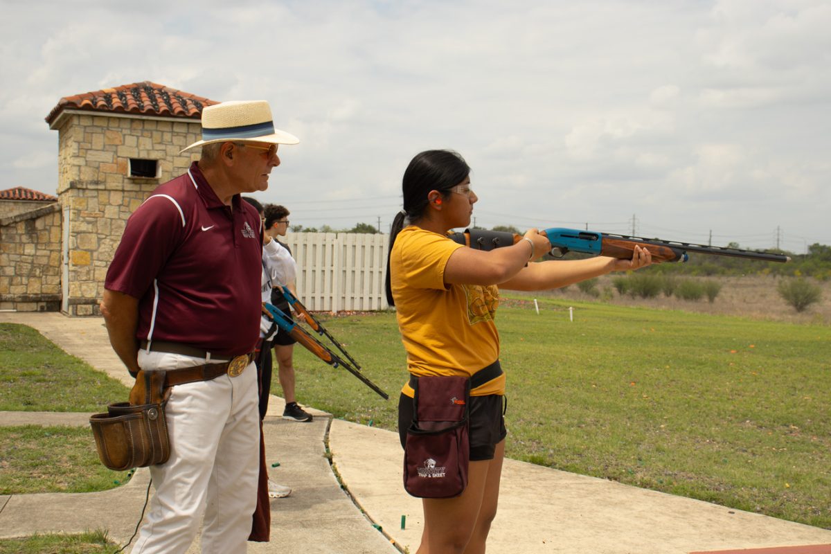 First-year Karely Salinas aims downrange during trap and skeet practice.
