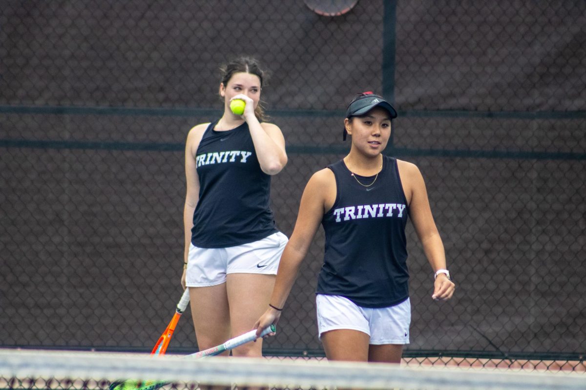 Sophomores Katie Schmidt and Lauren Tin take a break between sets on Feb. 14 at the Butch Newman Tennis Center.