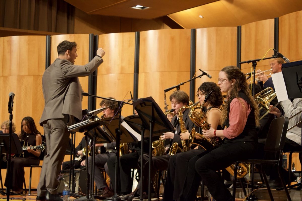 On April 12, 2026, Dr. Ryan Hagler, a Grammy-nominated bassist, is conducting his Jazz Ensemble in a performance of "A Samba for All Seasons" by Bill Liston.