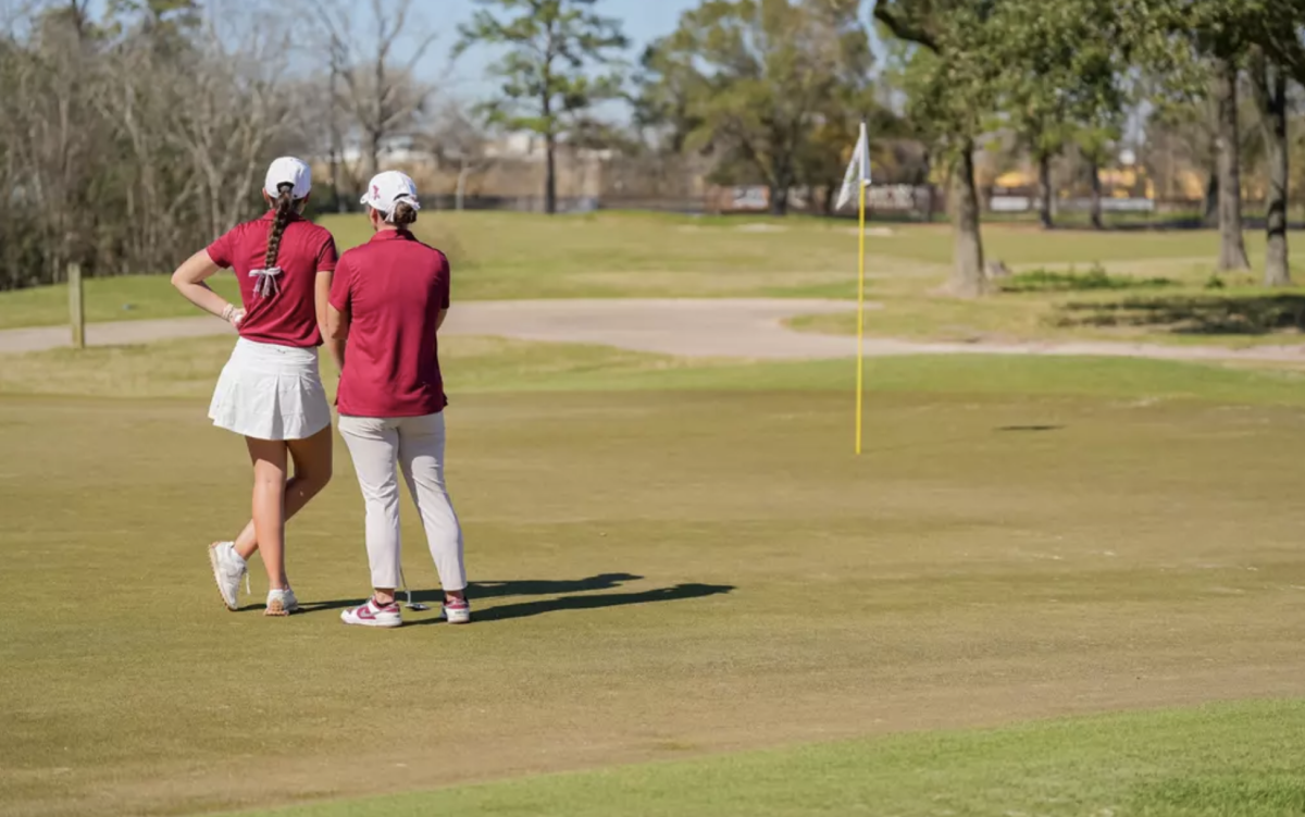 Head women’s golf coach SHELBY DEVORE coaches a putt at the Space City Classic on March 27.
Photo courtesy of TRINITY SPORTS INFORMATION