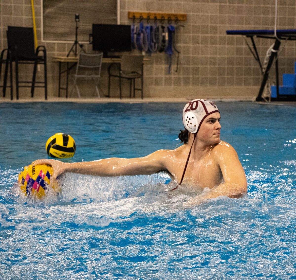 Connor Philpot ('28) gains power in the water as he kicks up, rounds his arm, and shoots towards the goal.